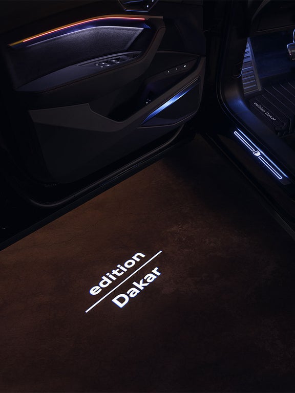Audi Q8 e-tron “edition Dakar” logo projected by LED onto the ground