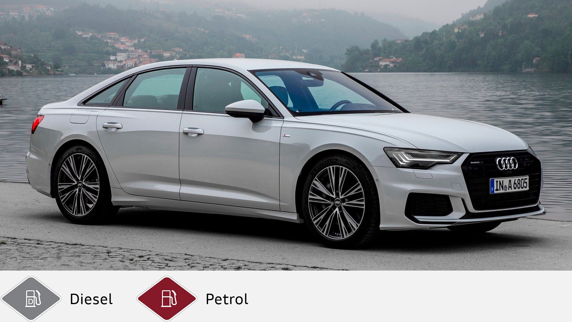 Silver Audi A6 Sedan (from 2018) in front of lakeshore with houses in the background. Gray diesel symbol and red petrol symbol at the bottom.