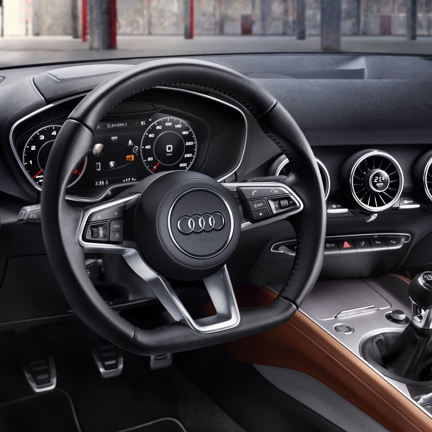 View of steering wheel and dashboard from drivers position in Audi TT Roadster.