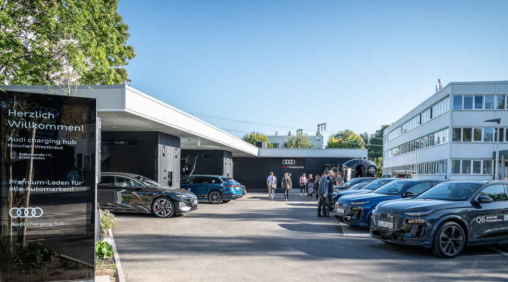 Audi Charging Hub with several Audi vehicles parked nearby