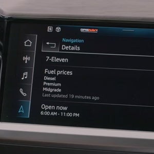 Close up of a car screen showing fuel price information