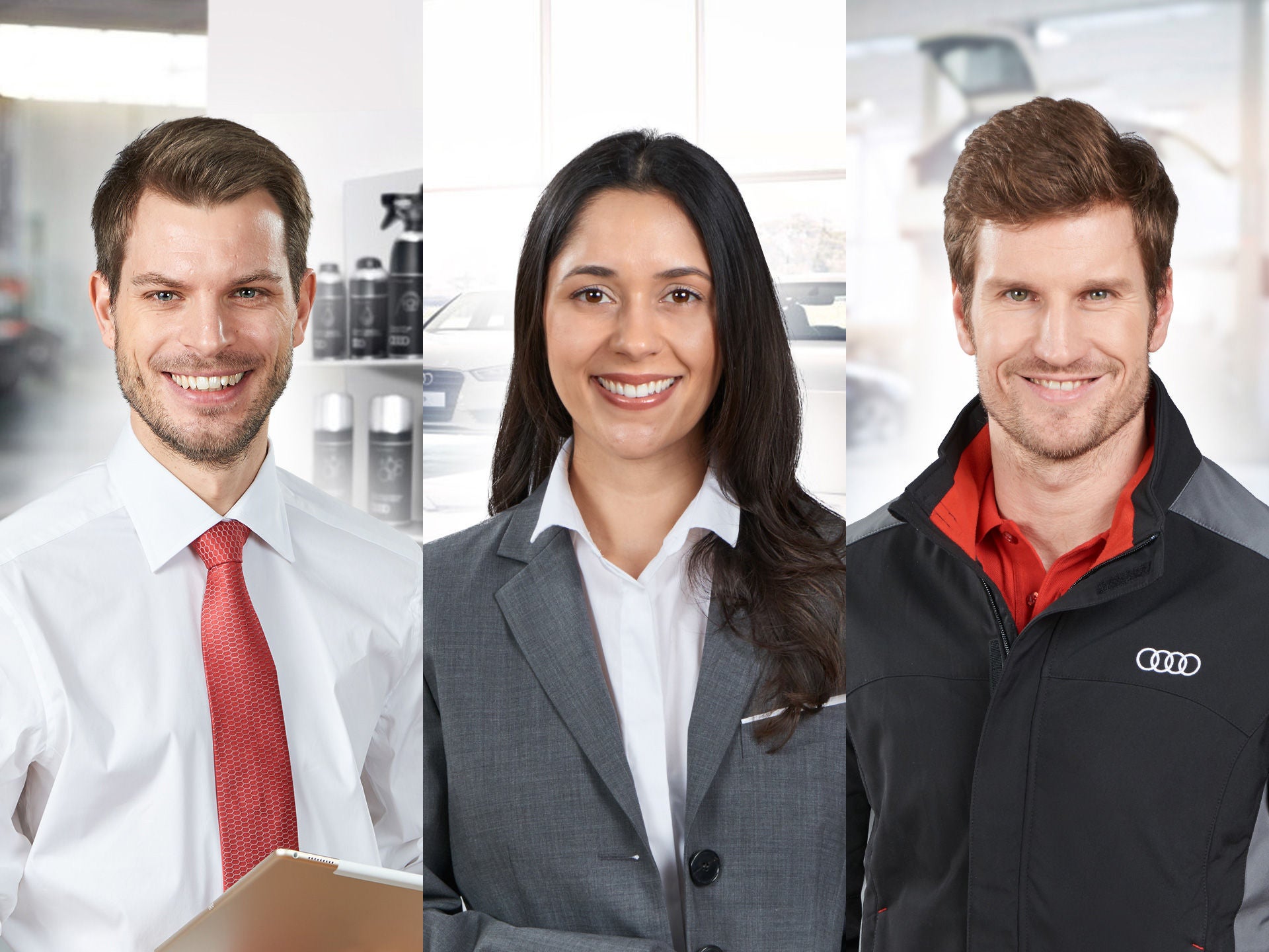 Drei freundlich lächelnde Personen in Business- und Audi-Arbeitskleidung nebeneinander vor neutralem Hintergrund