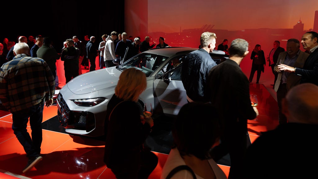 Customers inspecting the all-new Audi RS 5 Avant