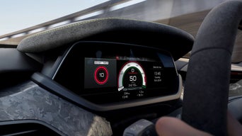 Digital car dashboard displaying speedometer and boost timer with driver's hands on wheel.