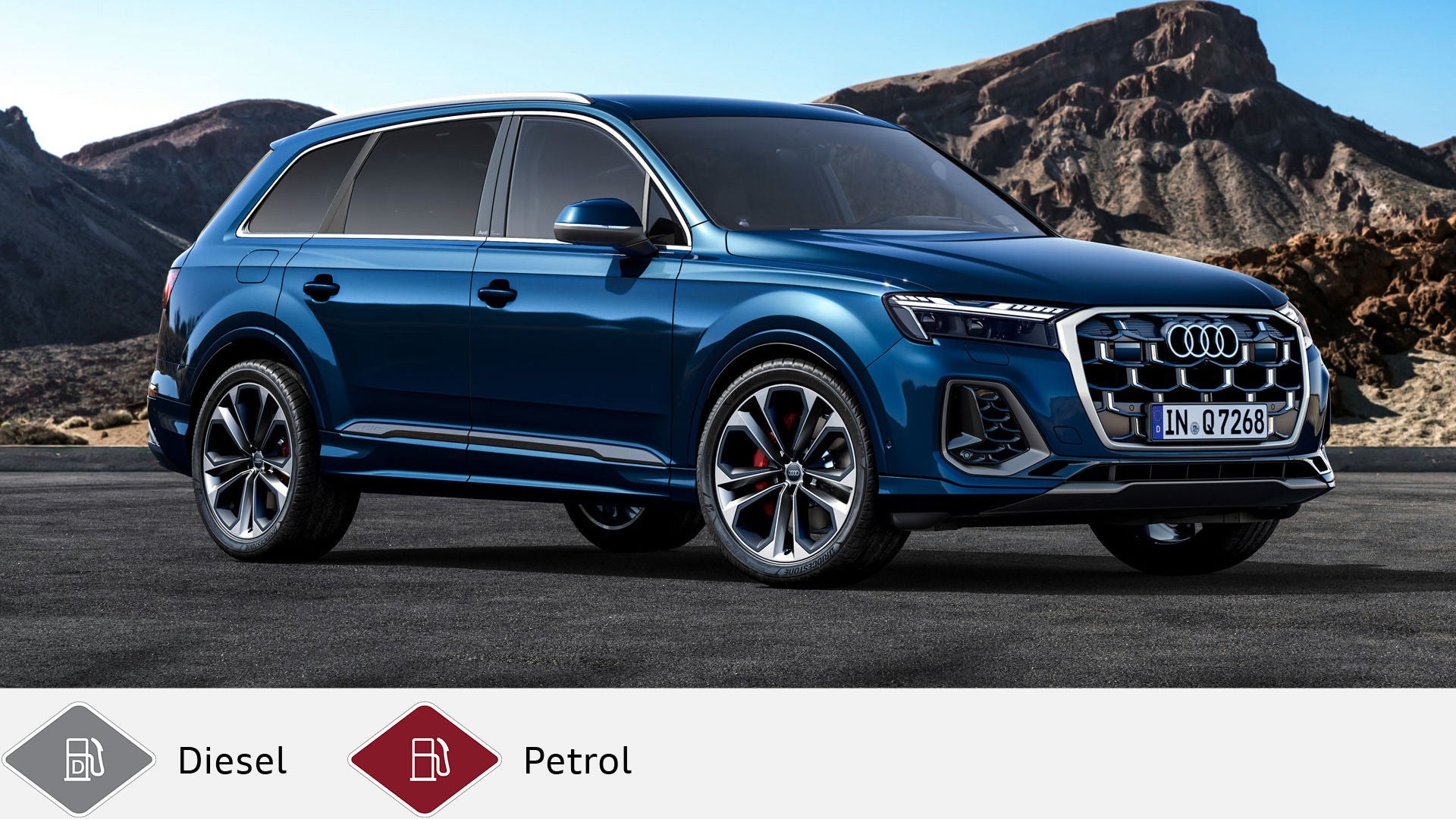 Blue Audi Q7 SUV standing in front of a rocky mountain landscape, slightly sideways front view. Below gray diesel symbol and red gasoline symbol.
