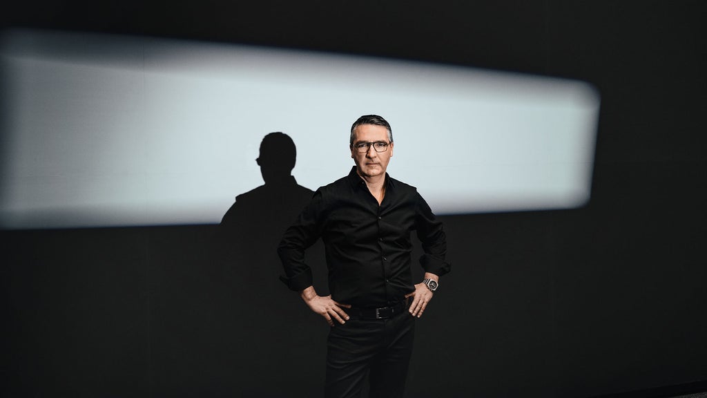 Portrait of César Muntada illuminated by a headlight