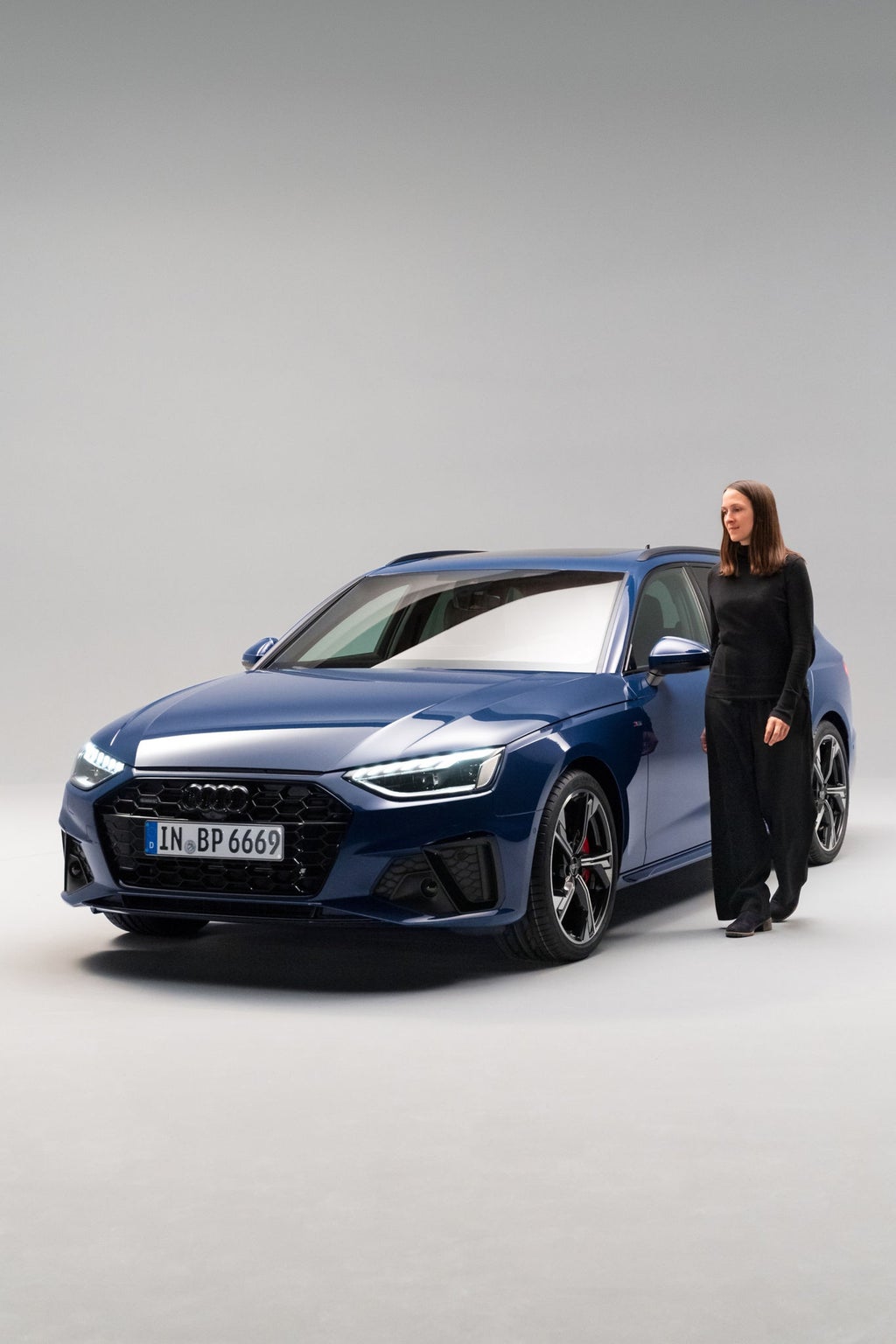 Jutta Schoberer walking past the Audi A4 Avant.