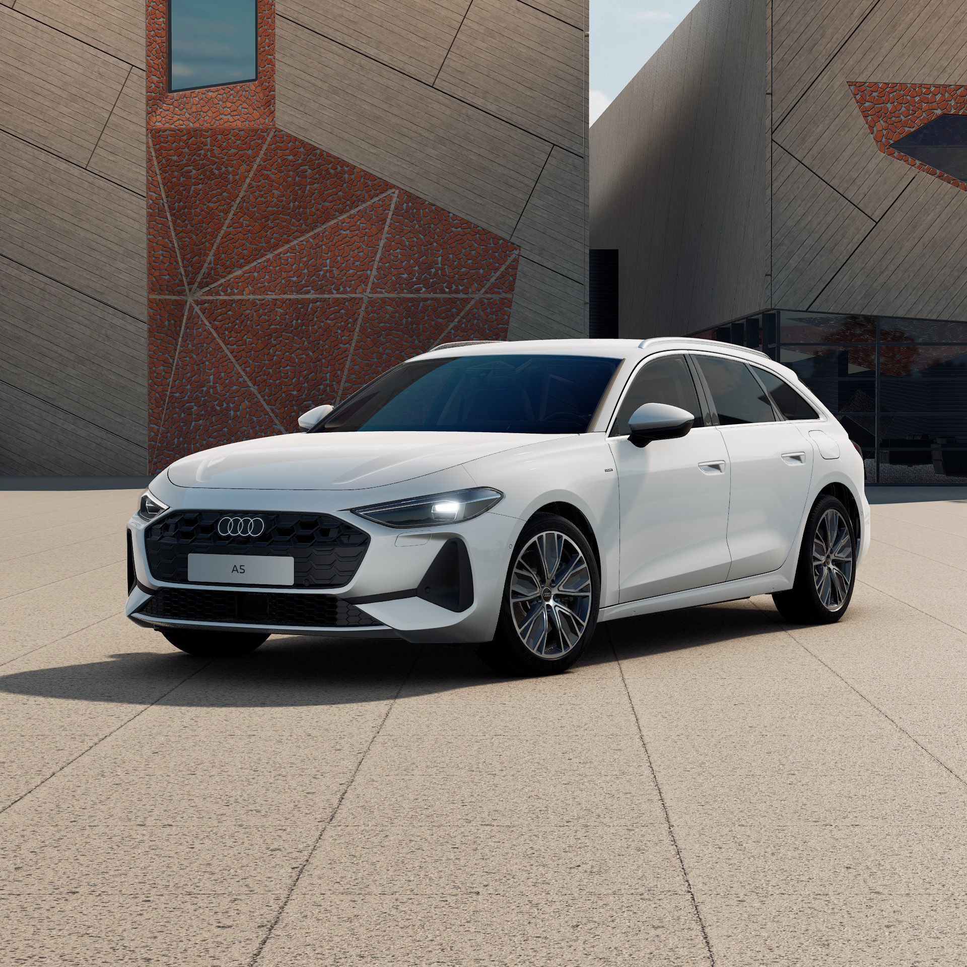 Ein Audi A5 Avant e-hybrid in Arkonaweiß schräg von vorne fotografiert vor einer futuristischen Kulisse