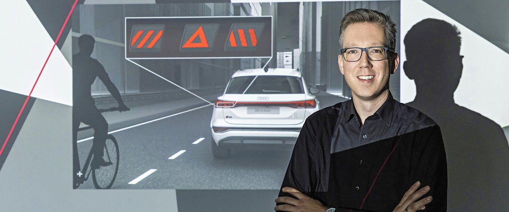 Porträt von Roland Kallweit neben einer Darstellung zur Fahrzeugsicherheit