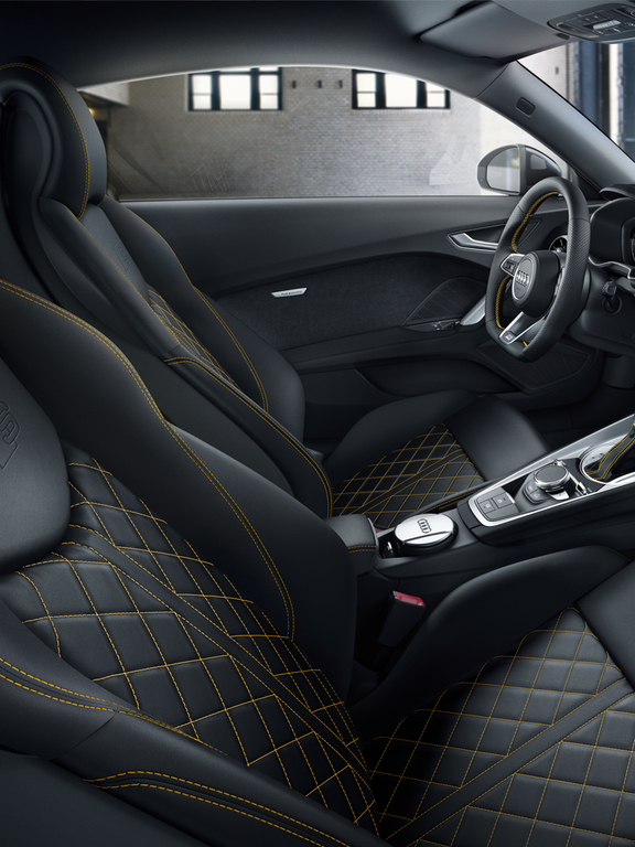 Interior of the TT Coupé with sports seats and contrast stitching in yellow