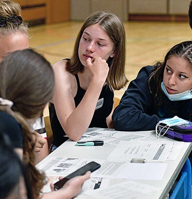 Students reenact a climate conference