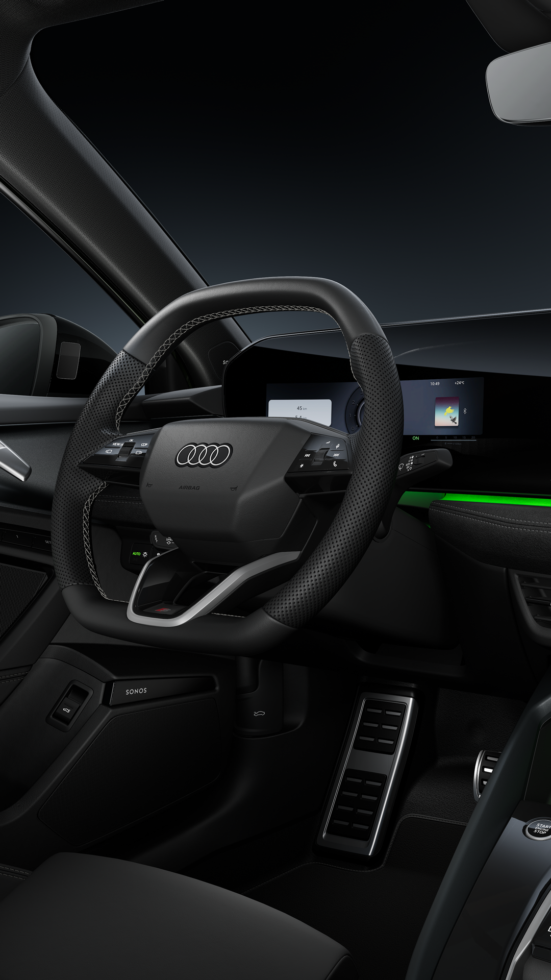 Blick auf das Cockpit mit Sportlenkrad, das geschwungene Panoramadisplay und das Ambiente-Licht.