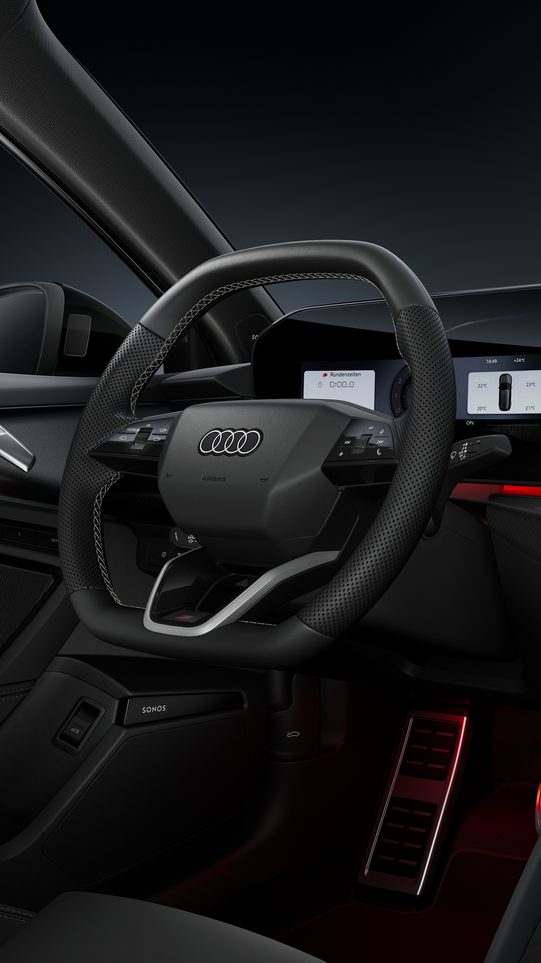 Blick auf das Cockpit mit Fokus auf das Sportlederlenkrad und das geschwungene Panoramadisplay.