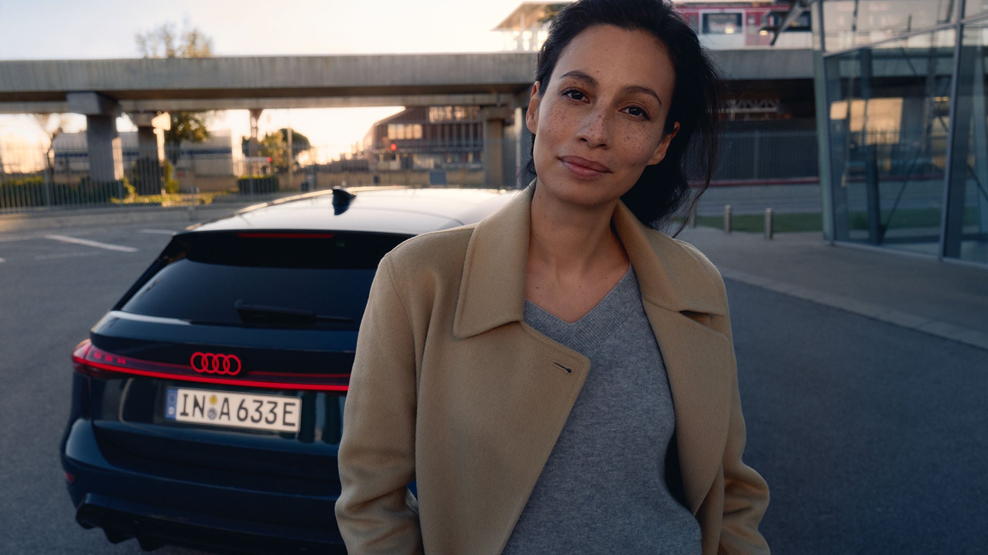 Satisfied customer in front of her Audi A6 e-tron