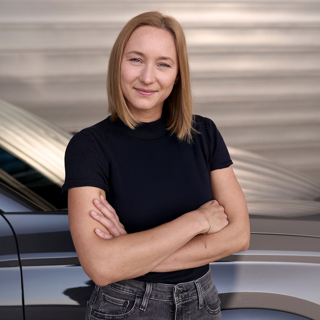 Sophia Schupritt looks into the camera and crosses her arms
