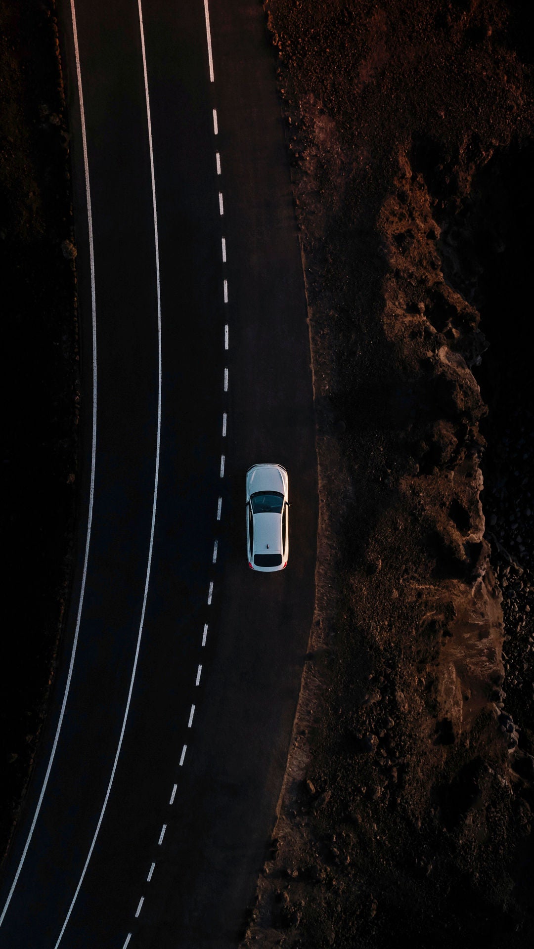 Audi A6 Sportback e-tron performance on a country road by the water