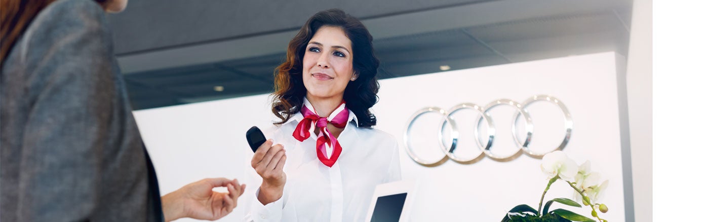 Audi staff member serving a customer