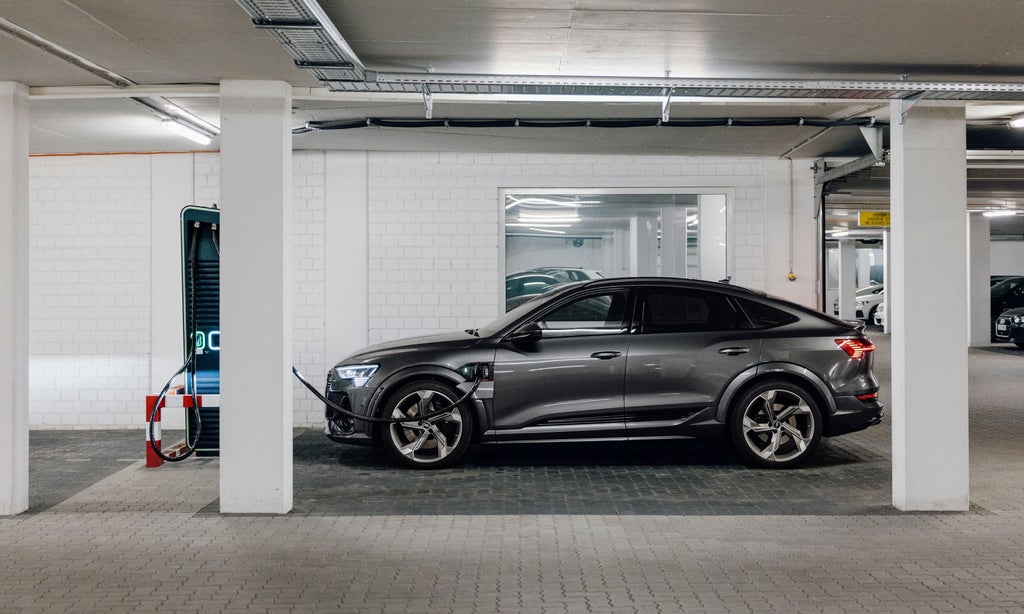 The Audi e-tron S Sportback charges in the underground car park.