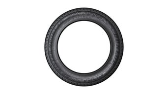 Freistehender Winterreifen von Dunlop mit sichtbarer Beschriftung und Reifenprofil.