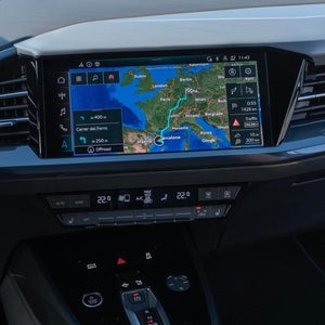 Close up of a car screen showing google navigation