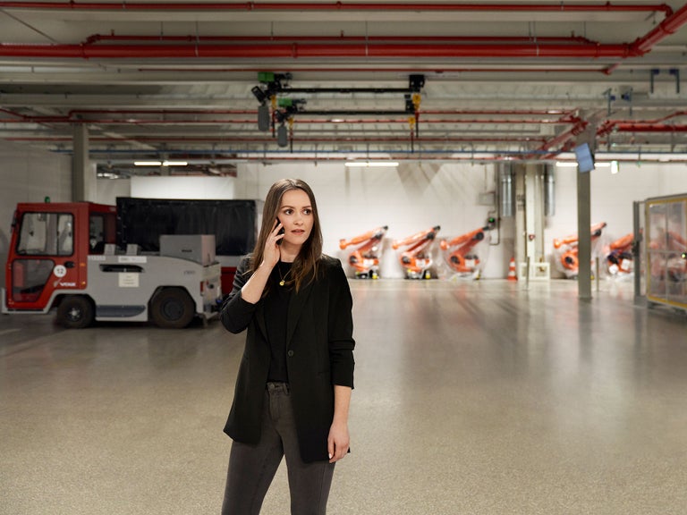 Sabrina is at the Audi production talking on her phone