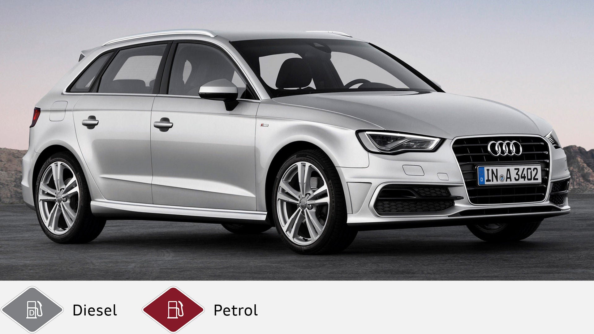 Silver Audi A3 Sportback stands in front of a gray landscape, photographed slightly from the front. Diesel and gasoline symbol at the bottom.