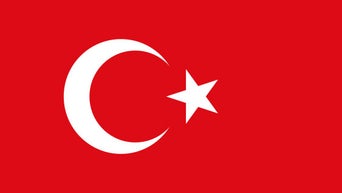 Flag of Turkey with a red background, white crescent moon, and a five-pointed star.
