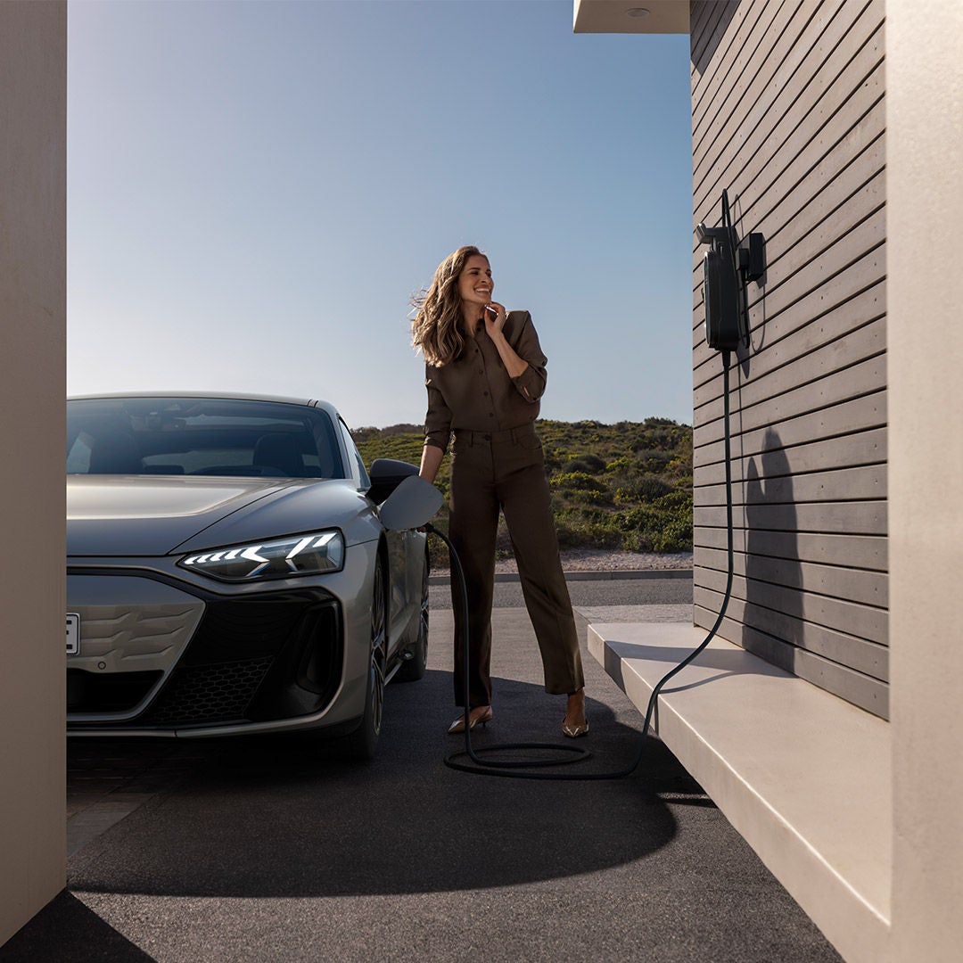 Woman charing E-tron car