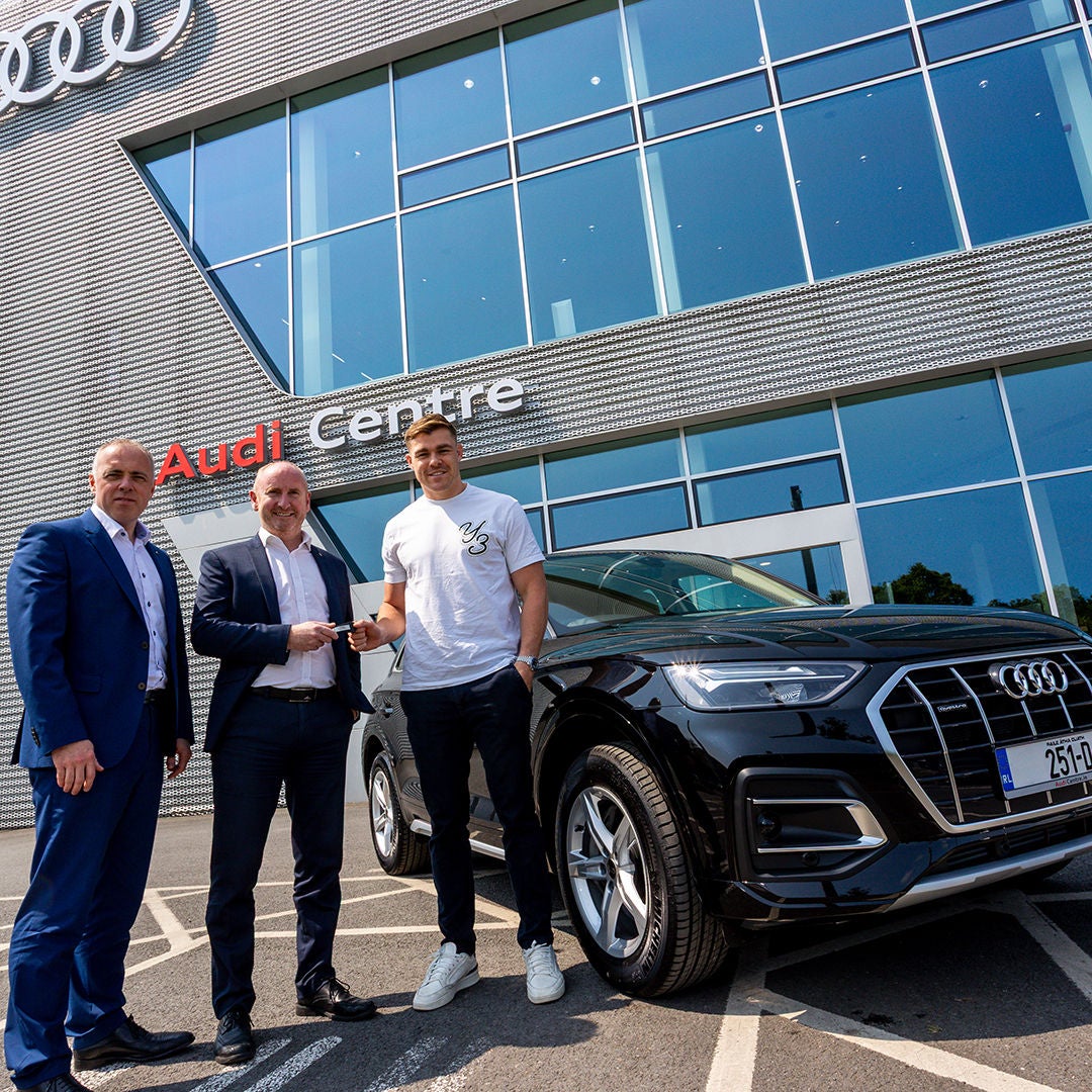 Garry Ringrose being handed the keys to his new Audi Q5 outside Audi Centre