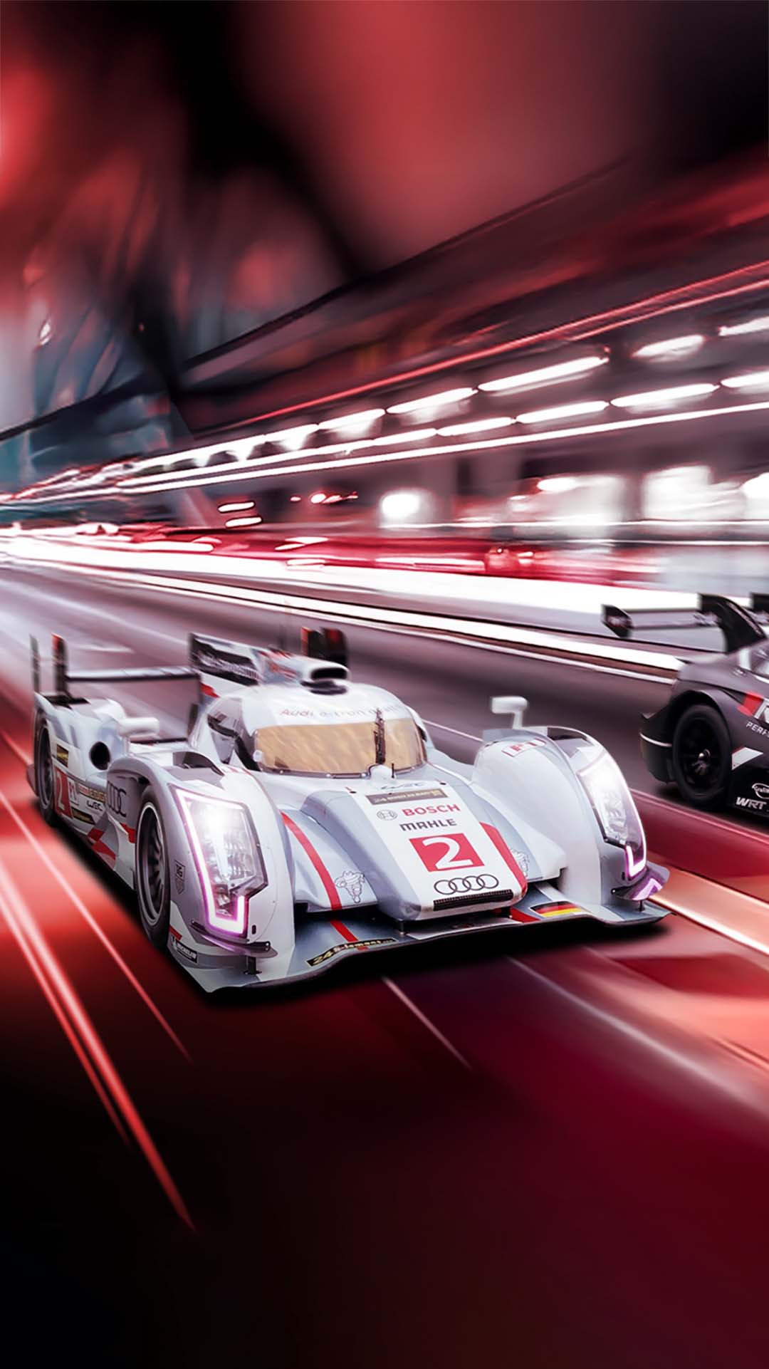 A picture showing a red background design depicting speed with the Audi R18 e-tron quattro and Audi RS 5 DTM race cars alongside each other.