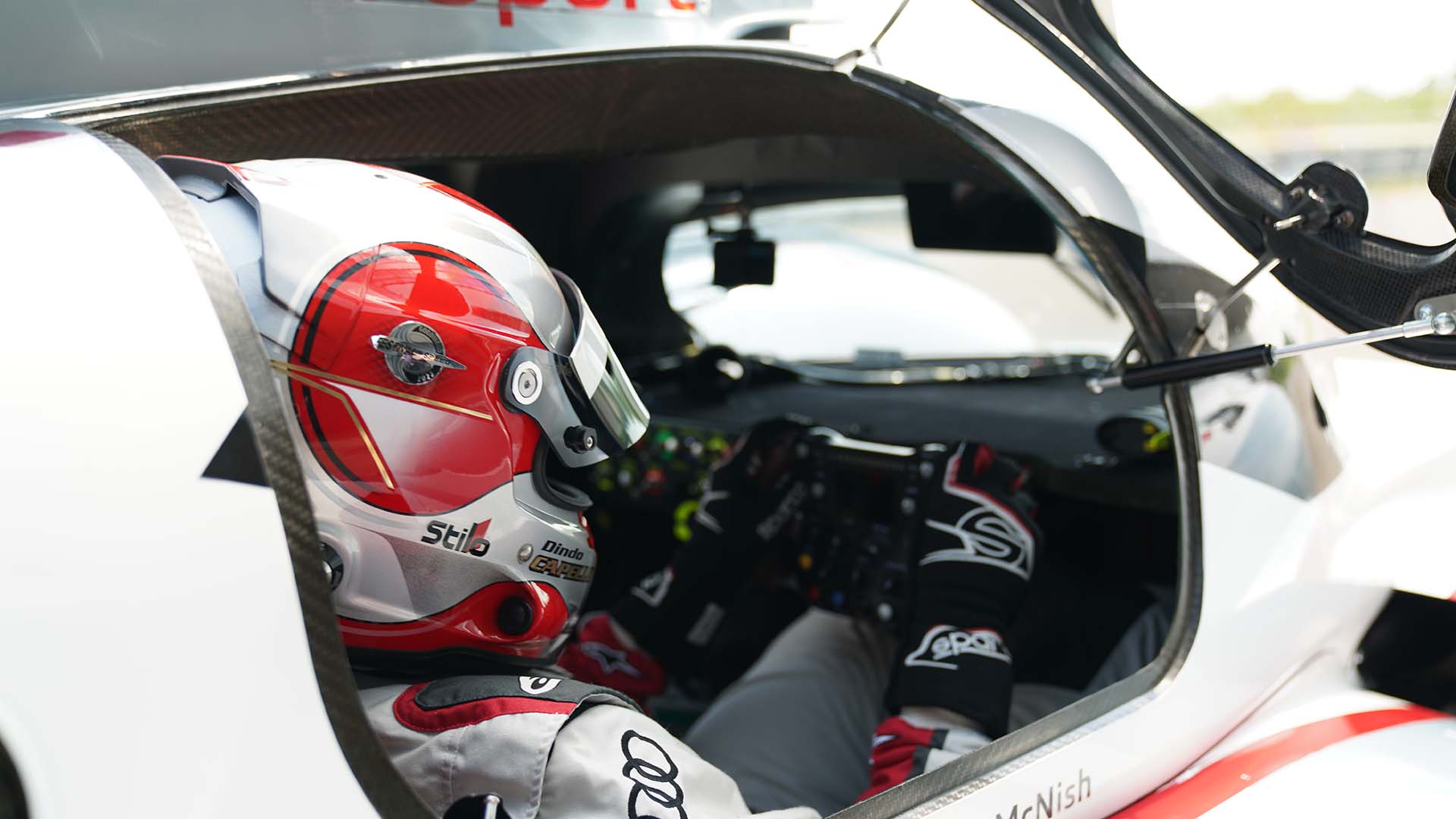 A picture showing the interior of an Audi R18 e-tron quattro race car on display in Neuburg.