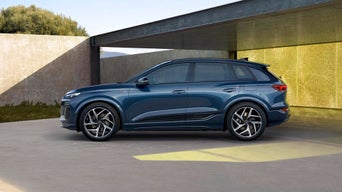 Parked Blue Audi SUV on shaded patio