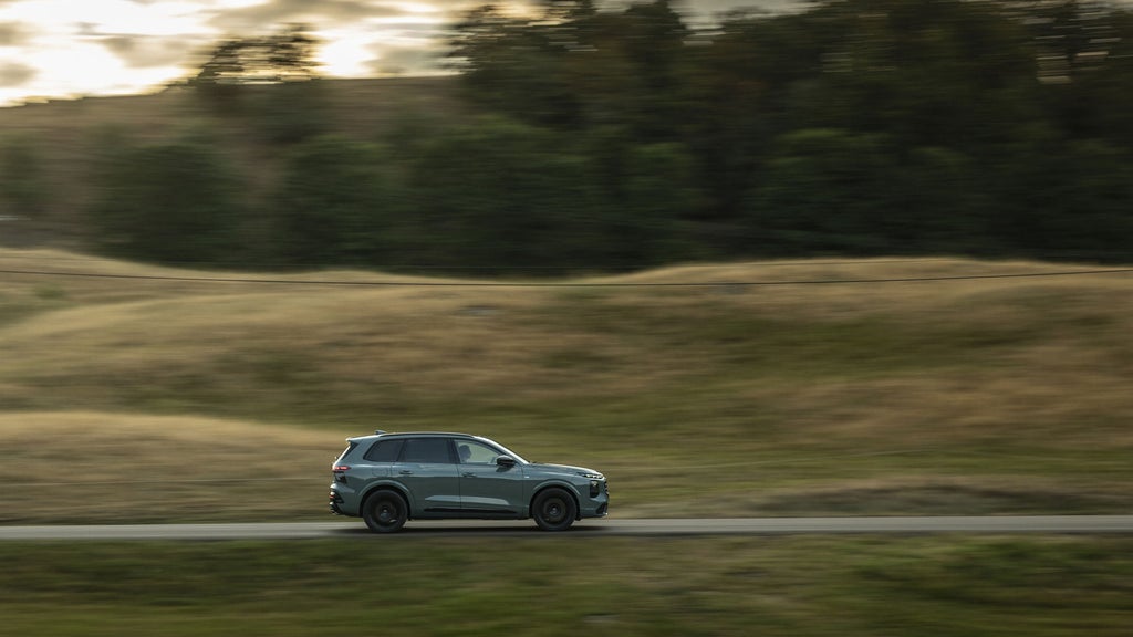 All-new Audi Q7 driving on a country road
