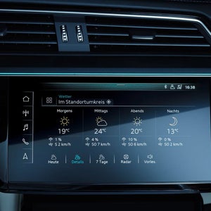 Close up of a car screen showing weather information