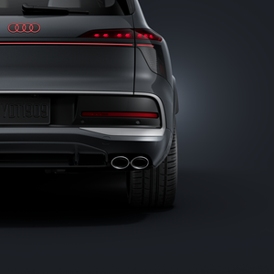 A close-up of the rear right-hand side, showing the exhaust tailpipes and the 23-inch wheel.