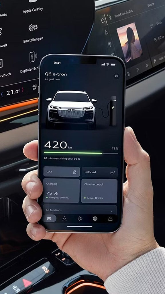Interior of an Audi vehicle showing a digital dashboard and touchscreen control panels