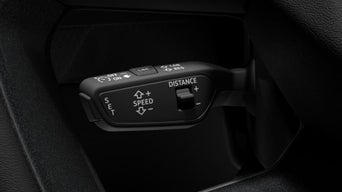 Vehicle's cruise control settings on a steering wheel stalk.