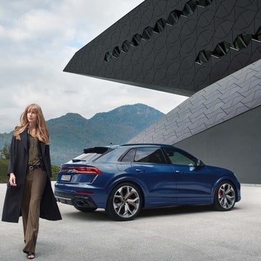 Blue Rs Q8 from behind with model