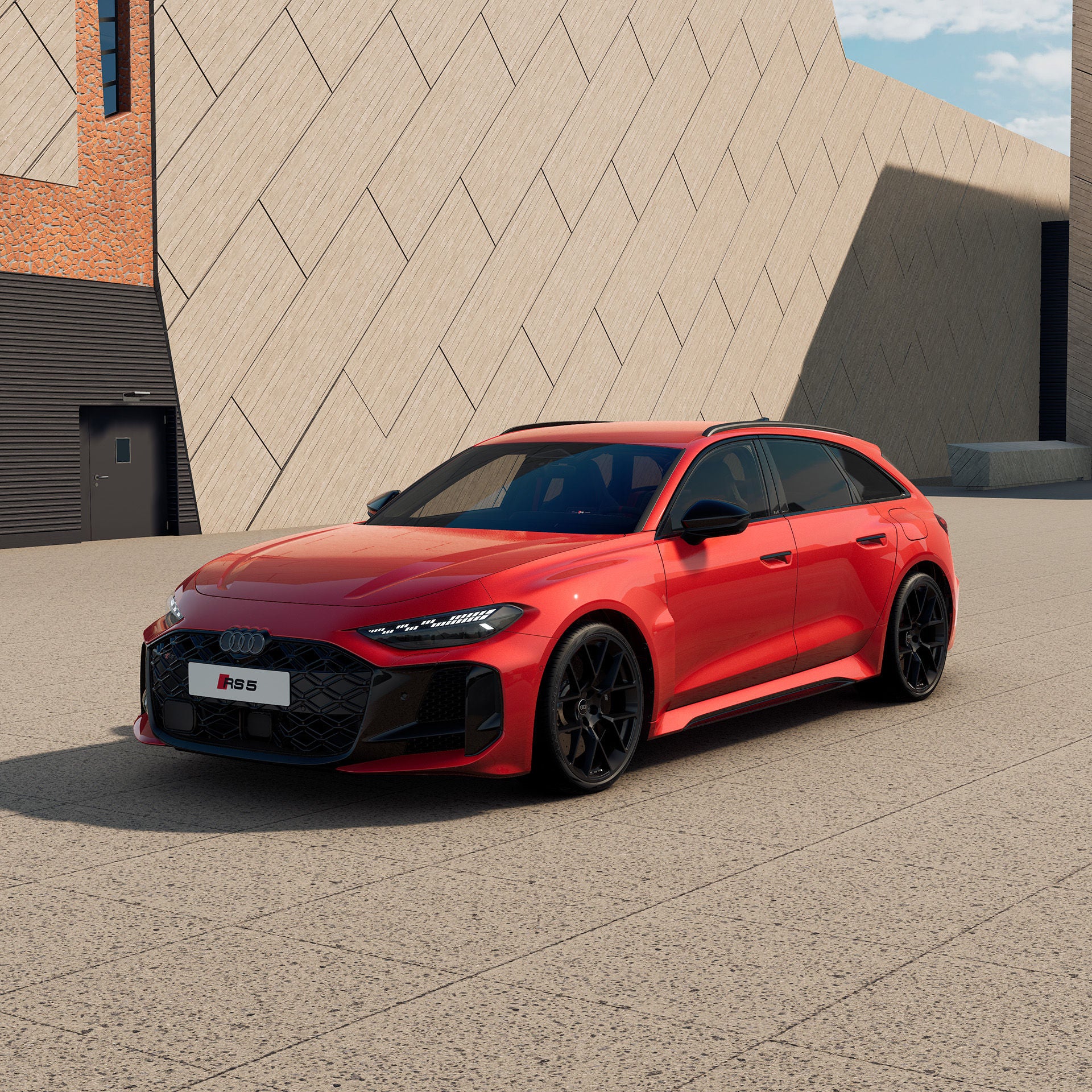 3/4 Ansicht eines roten Audi RS5 Avant vor einem modernen Gebäude