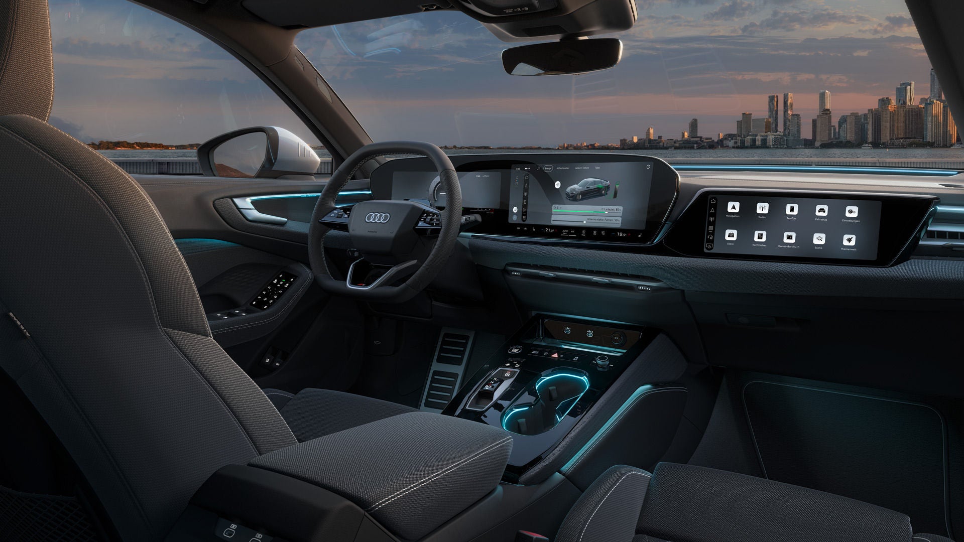 Blick in das Cockpit der A5 Limousine e-hybrid. Zu sehen sind unter anderem die Panoramadisplays und Ambiente Lichter.