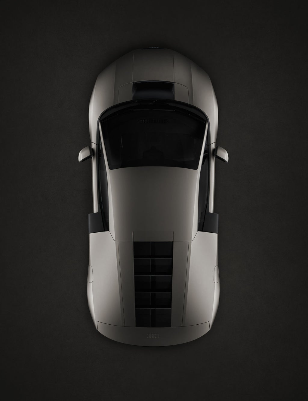 Vy uppifrån av Audi Nuvolari, med fokus på dess skulpterade karosseri och mittmotorproportioner.
