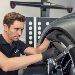 A man changing a car tyre