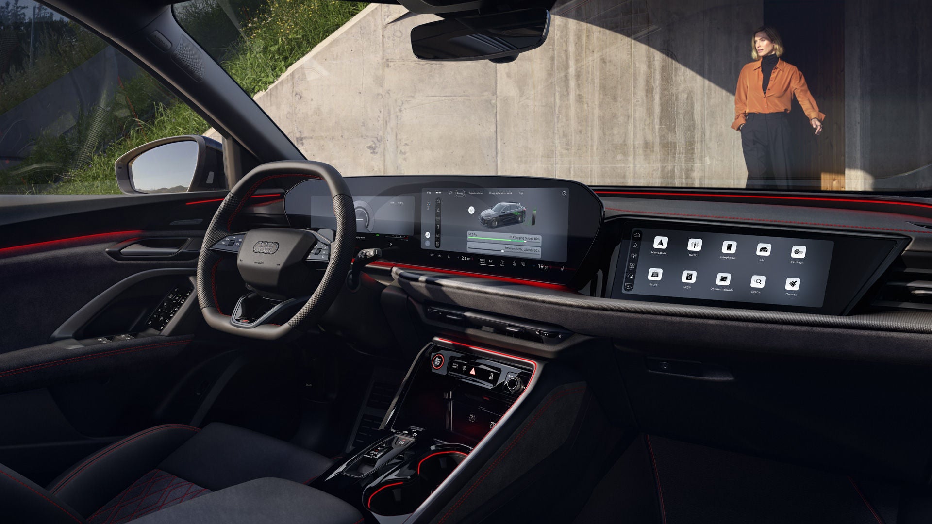 The interior of the Q5 Sportback e-hybrid with a focus on the cockpit and steering wheel.