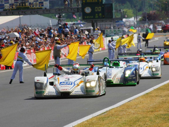 A picture showing the victory of the Audi R8 at Le Mans in 2005.
