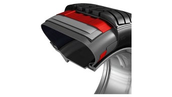 Querschnitt eines Reifens mit farblich hervorgehobenen Schichten der inneren Struktur.