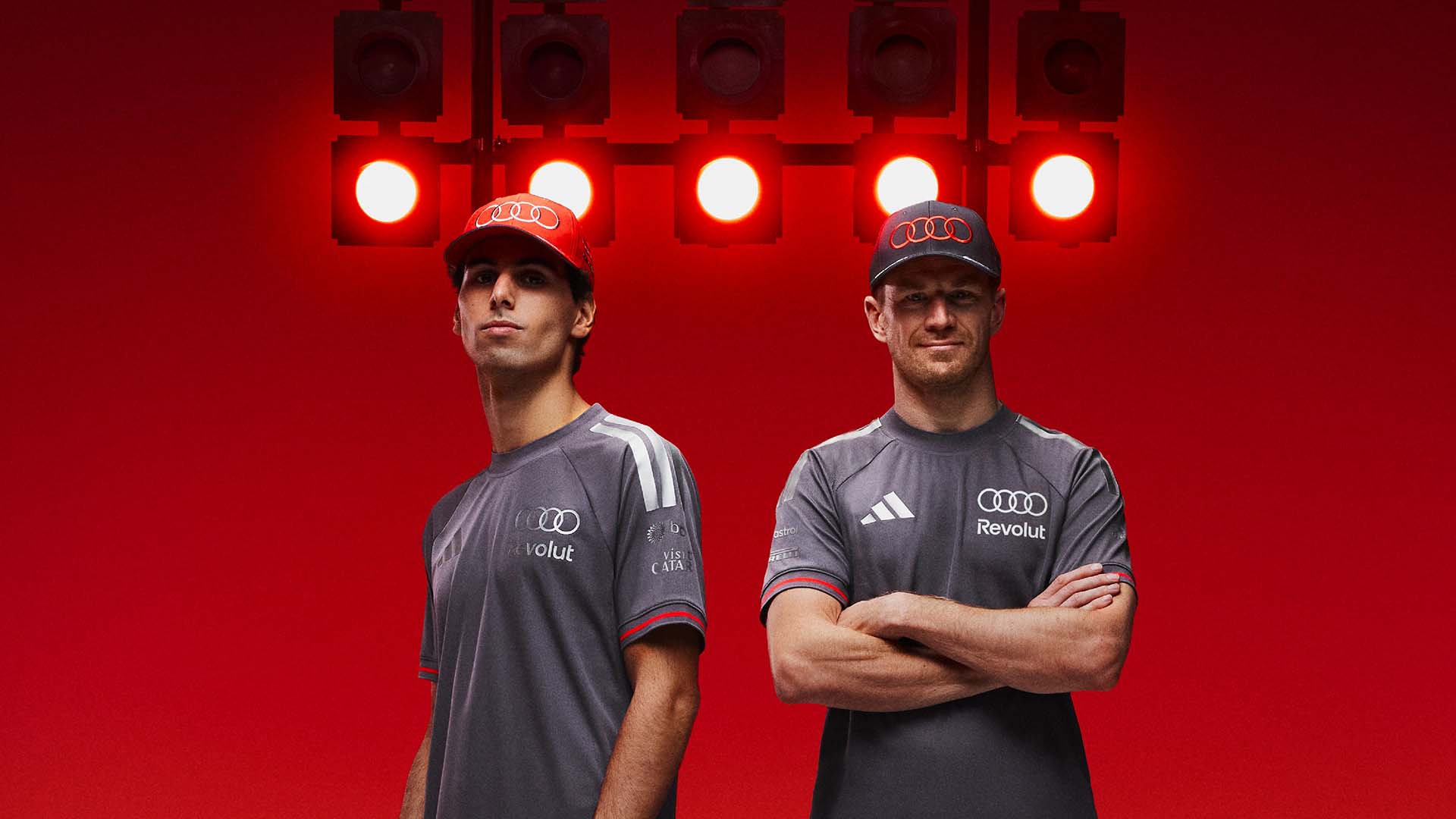 A picture showing Nico Hulkenberg and Gabriel Bortoleto wearing clothing from the team’s collection from adidas.