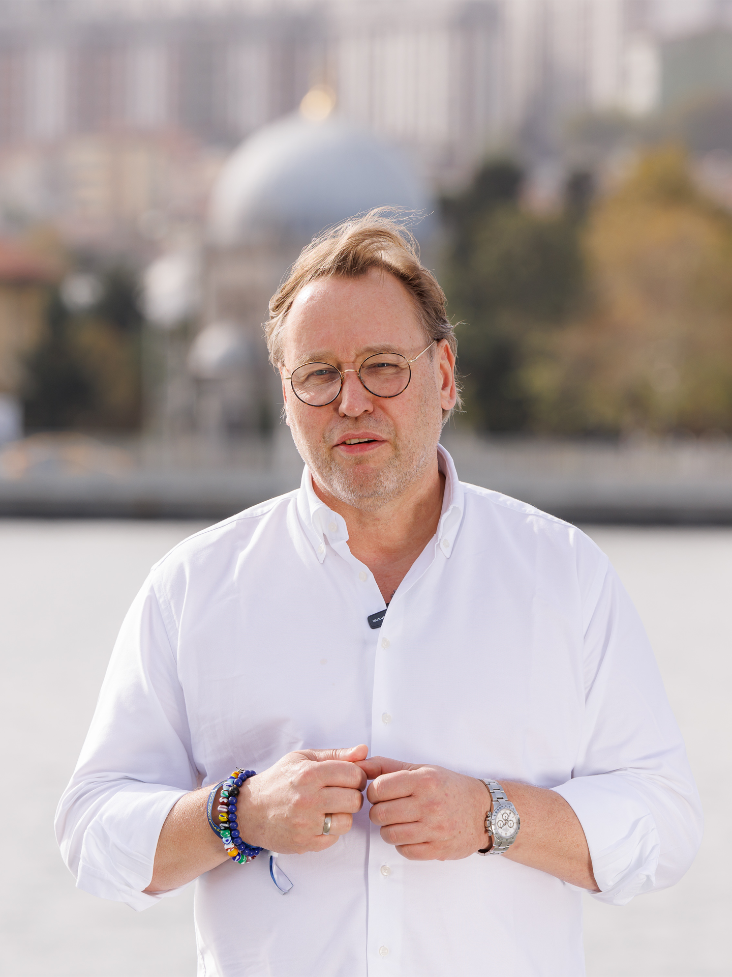 Audi RS e-tron GT sports car on a concrete surface in front of futuristic architecture