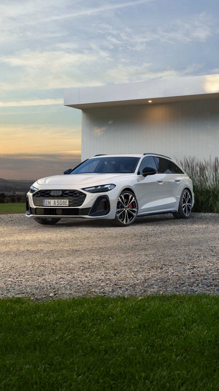 Audi A5 Avant e-hybrid in a parking lot in half side view