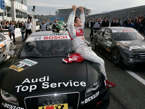 A picture of Timo Scheider celebrating his DTM title at Hockenheim in 2008.