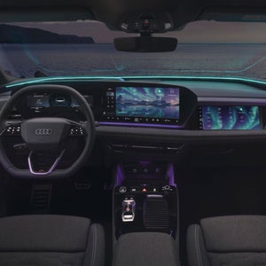 Interior of an Audi car with a light theme